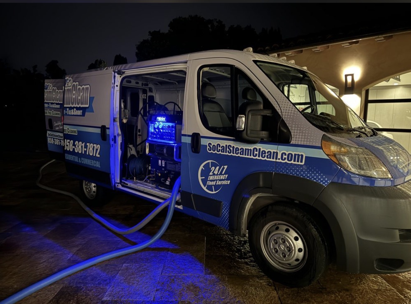 SoCal Steam Clean service van at night with truck-mounted cleaning equipment